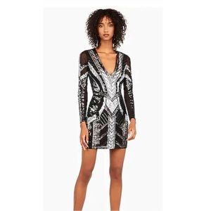Deep V-Neck sequin bodycon dress with mesh long sleeves from Express.